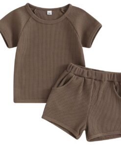 A unisex baby and toddler waffle-knit loungewear set in a rich coffee brown colour, including a short-sleeved top and matching shorts with pockets.