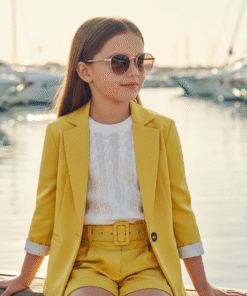 A chic three-piece children's suit in bright yellow, featuring a tailored blazer, matching belted shorts, and a white knitted top.