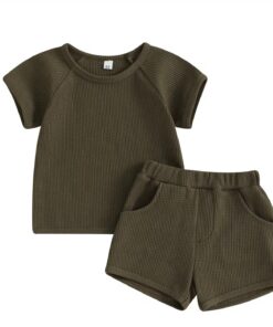 A unisex baby and toddler waffle-knit loungewear set in a deep dark brown colour, including a short-sleeved top and matching shorts with pockets.