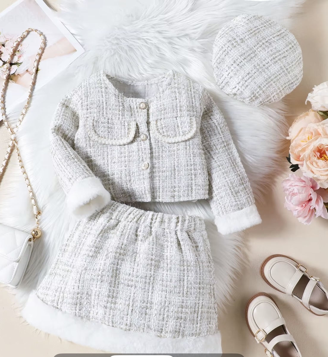 A chic three-piece girls' outfit in a winter white tweed, featuring a jacket and skirt trimmed with white faux fur, and a matching tweed beret
