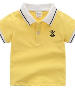 A smart boy's polo shirt in a sunflower yellow, featuring a white collar and cuffs with black tipping stripes, and a small embroidered crest on the chest.