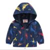 A lightweight, navy blue showerproof raincoat for a child, featuring a hood and a colourful all-over print of various dinosaurs.