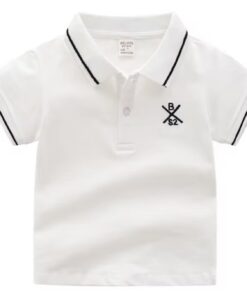 A smart boy's polo shirt in crisp white, featuring a collar and cuffs with classic navy blue tipping stripes, and a small embroidered crest on the chest.