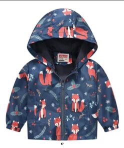 A lightweight, navy blue showerproof raincoat for a child, featuring a hood and a colourful all-over print of cute orange foxes, holly, and snowflakes.